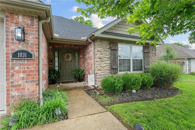 1031 Charles St, Pea Ridge, AR 72751 - property entrance featuring roof with shingles, stone siding, and brick siding