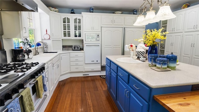 14559 Zimmerman Ln, Rogers, AR 72756 - kitchen featuring blue cabinets, a sink, stainless steel gas range oven, under cabinet range hood, and white cabinets