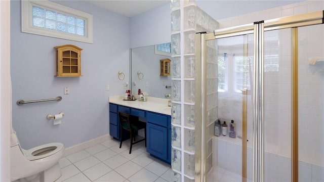 14559 Zimmerman Ln, Rogers, AR 72756 - full bathroom featuring vanity, tile patterned flooring, toilet, and a stall shower