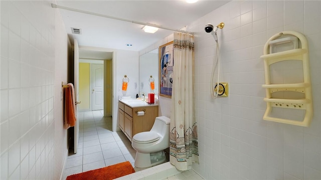 14559 Zimmerman Ln, Rogers, AR 72756 - full bath with vanity, tile walls, tile patterned floors, curtained shower, and toilet