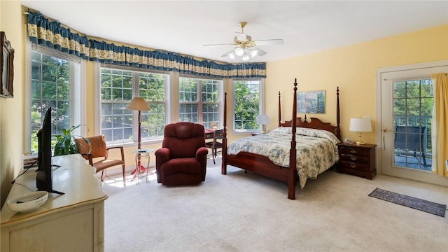 14559 Zimmerman Ln, Rogers, AR 72756 - carpeted bedroom featuring multiple windows, access to exterior, and ceiling fan