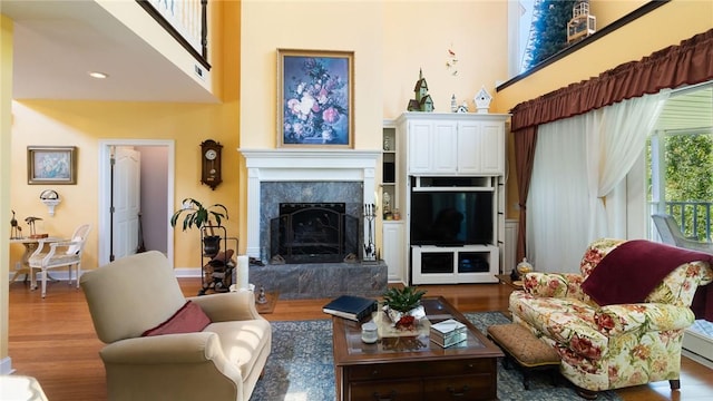 14559 Zimmerman Ln, Rogers, AR 72756 - living room with wood finished floors, a high end fireplace, and a high ceiling