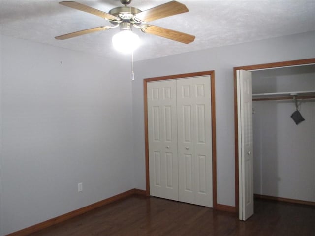 9 Rancho Vista Ln, Holiday Island, AR 72631 - unfurnished bedroom featuring two closets, wood finished floors, and ceiling fan