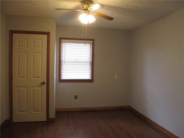 9 Rancho Vista Ln, Holiday Island, AR 72631 - unfurnished room featuring dark wood finished floors and a ceiling fan