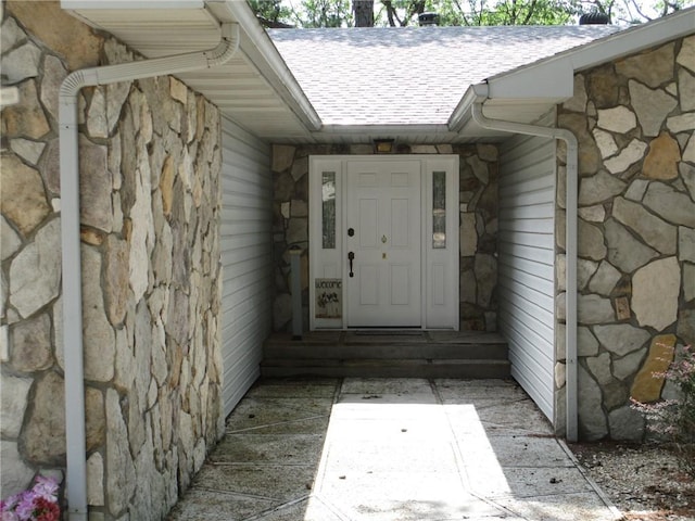 9 Rancho Vista Ln, Holiday Island, AR 72631 - property entrance featuring stone siding and a shingled roof