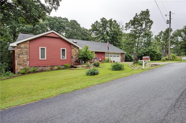 4 Branchwood Ln, Bella Vista, AR 72715 - ranch-style house with an attached garage, a front lawn, view of wooded area, and stone siding