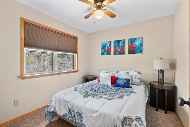 2480 N Saint Andrews Dr, Kansas, OK 74347 - carpeted bedroom with baseboards and a ceiling fan