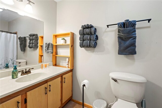 2480 N Saint Andrews Dr, Kansas, OK 74347 - bathroom with toilet, vanity, a shower with curtain, and tile patterned floors