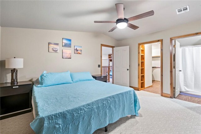 2480 N Saint Andrews Dr, Kansas, OK 74347 - bedroom featuring a spacious closet, carpet flooring, ceiling fan, baseboards, and vaulted ceiling