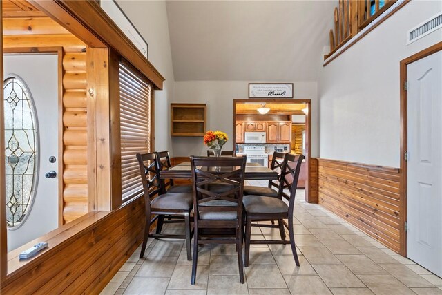 2480 N Saint Andrews Dr, Kansas, OK 74347 - dining space featuring healthy amount of natural light, high vaulted ceiling, and light tile patterned flooring