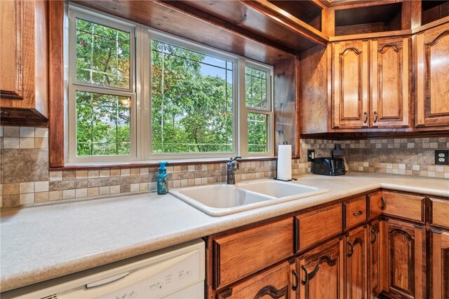 2480 N Saint Andrews Dr, Kansas, OK 74347 - kitchen with a sink, dishwasher, backsplash, and light countertops
