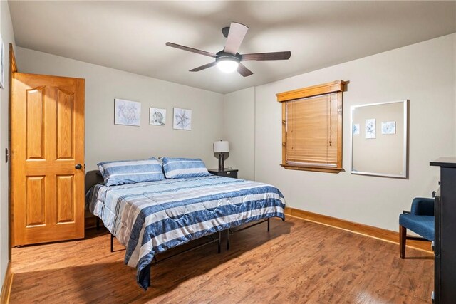 2480 N Saint Andrews Dr, Kansas, OK 74347 - bedroom with wood finished floors, baseboards, and a ceiling fan
