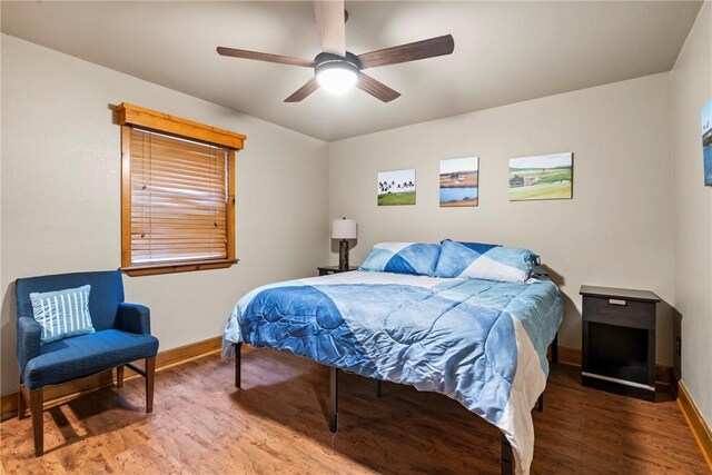 2480 N Saint Andrews Dr, Kansas, OK 74347 - bedroom with baseboards, wood finished floors, and a ceiling fan