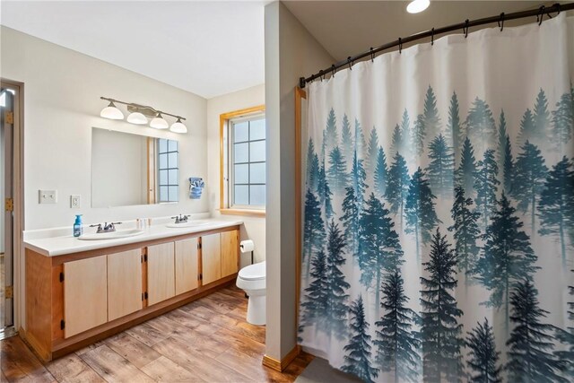 2480 N Saint Andrews Dr, Kansas, OK 74347 - full bath with double vanity, wood finished floors, toilet, and a shower with curtain