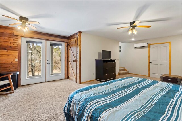 2480 N Saint Andrews Dr, Kansas, OK 74347 - carpeted bedroom featuring a wall unit AC, access to outside, french doors, baseboards, and a ceiling fan