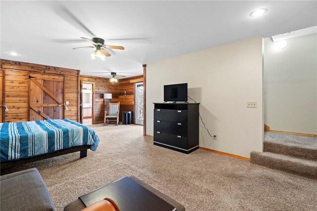 2480 N Saint Andrews Dr, Kansas, OK 74347 - bedroom with carpet flooring, wooden walls, baseboards, and ceiling fan