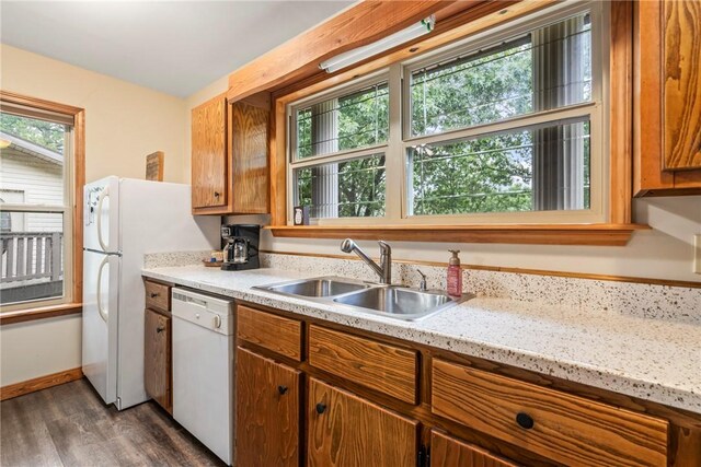 2480 N Saint Andrews Dr, Kansas, OK 74347 - kitchen featuring white appliances, a sink, healthy amount of natural light, and dark wood-style flooring