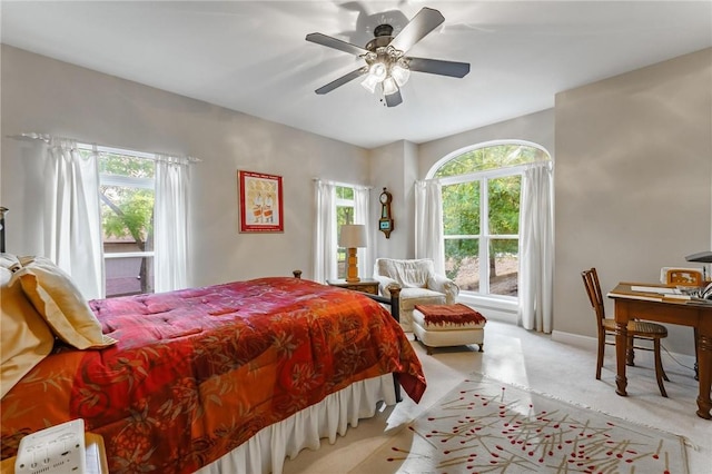 47 Rath Dr, Bella Vista, AR 72715 - carpeted bedroom featuring multiple windows, baseboards, and a ceiling fan
