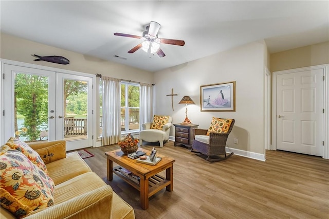 47 Rath Dr, Bella Vista, AR 72715 - living area with a ceiling fan, light wood-style floors, and baseboards