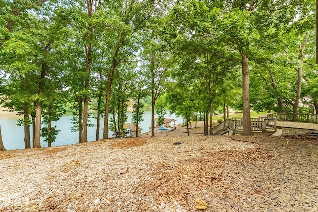 47 Rath Dr, Bella Vista, AR 72715 - view of yard with view of wooded area and a deck with water view