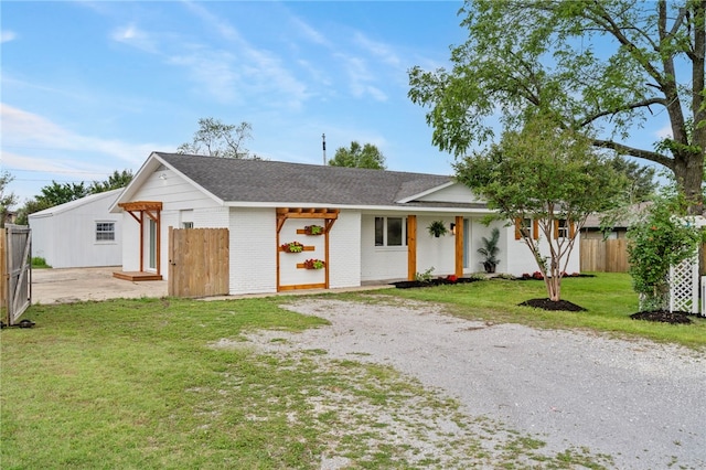 1089 Elway Dr, Springdale, AR 72764 - ranch-style house with roof with shingles, gravel driveway, and brick siding