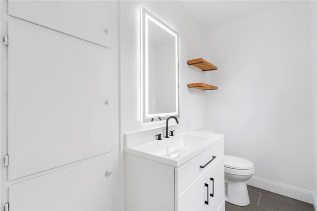 1089 Elway Dr, Springdale, AR 72764 - bathroom with vanity, toilet, and baseboards