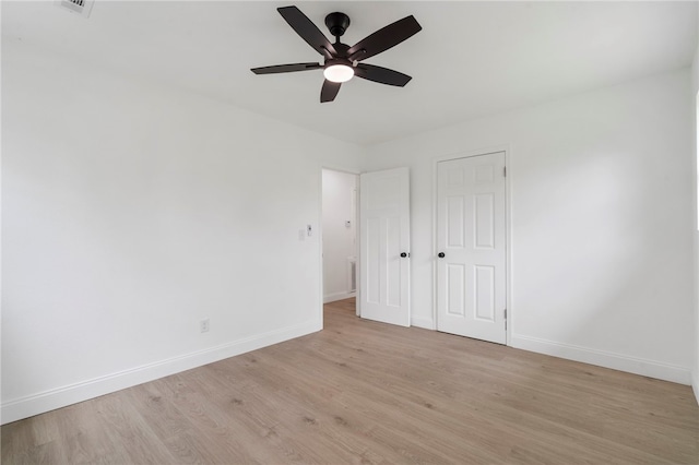 1089 Elway Dr, Springdale, AR 72764 - unfurnished bedroom featuring baseboards, light wood-style flooring, a ceiling fan, and a closet