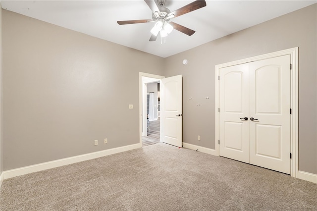 22704 Oakview Rd, Siloam Springs, AR 72761 - unfurnished bedroom with carpet flooring, baseboards, a closet, and ceiling fan