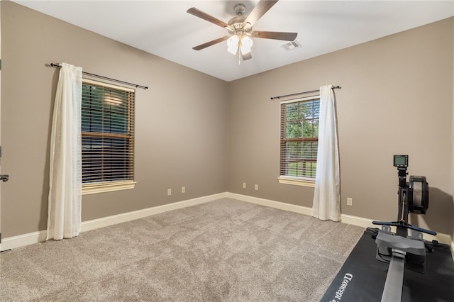 22704 Oakview Rd, Siloam Springs, AR 72761 - exercise area with ceiling fan, carpet flooring, and baseboards