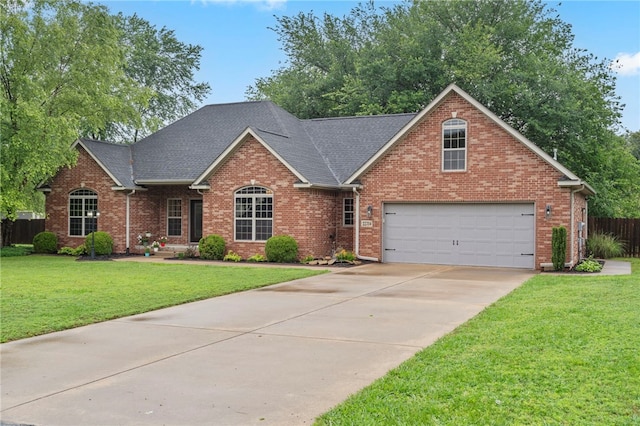 22704 Oakview Rd, Siloam Springs, AR 72761 - traditional-style house with concrete driveway, brick siding, and a shingled roof