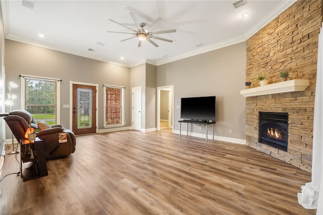 22704 Oakview Rd, Siloam Springs, AR 72761 - living area with ceiling fan, wood finished floors, ornamental molding, a fireplace, and baseboards