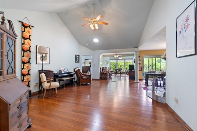 16 Osage Ln, Holiday Island, AR 72631 - living room with a ceiling fan, ornate columns, wood finished floors, arched walkways, and high vaulted ceiling