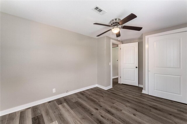 2182 Shumate, Springdale, AR 72762 - unfurnished bedroom with baseboards, dark wood finished floors, and a ceiling fan