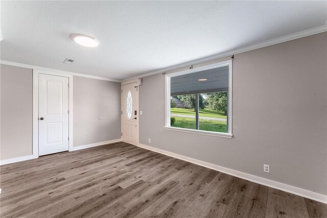 2182 Shumate, Springdale, AR 72762 - foyer entrance featuring wood finished floors, baseboards, and crown molding