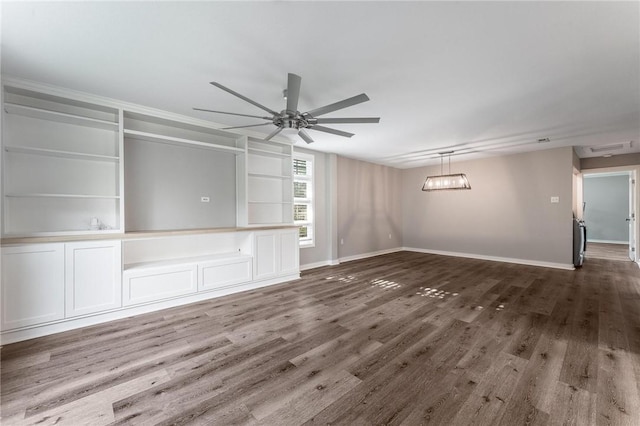 2182 Shumate, Springdale, AR 72762 - unfurnished living room featuring a ceiling fan, wood finished floors, built in shelves, and baseboards