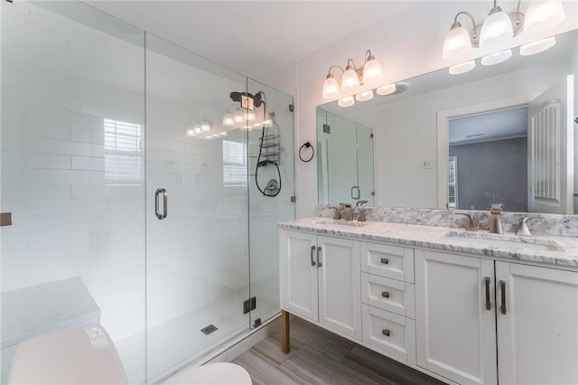 2182 Shumate, Springdale, AR 72762 - full bath featuring double vanity, a stall shower, and wood finished floors