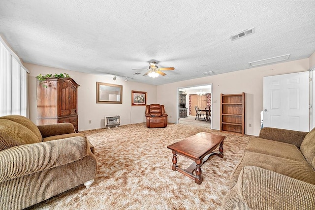 634 Orchard View Ests, Alma, AR 72921 - living area with carpet flooring, a ceiling fan, a textured ceiling, and baseboards