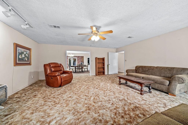 634 Orchard View Ests, Alma, AR 72921 - carpeted living room with a textured ceiling, ceiling fan, a chandelier, and heating unit
