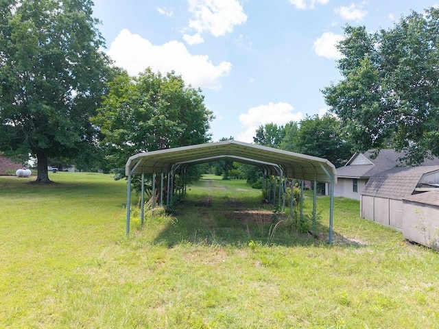 634 Orchard View Ests, Alma, AR 72921 - view of grassy yard featuring a detached carport