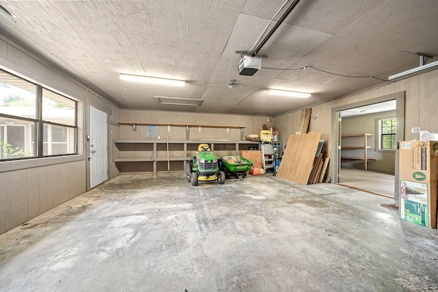 634 Orchard View Ests, Alma, AR 72921 - garage with a garage door opener and wooden walls