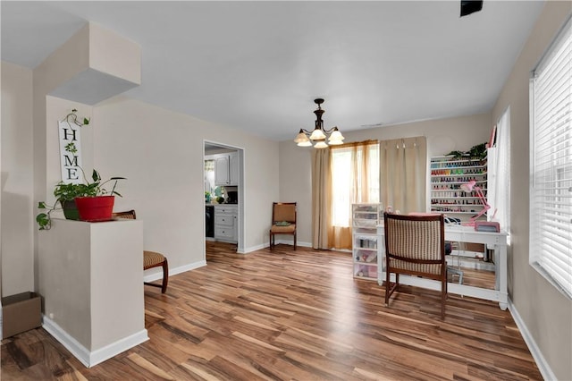 320 S Pleasant St, Springdale, AR 72764 - sitting room with a chandelier, healthy amount of natural light, and wood finished floors