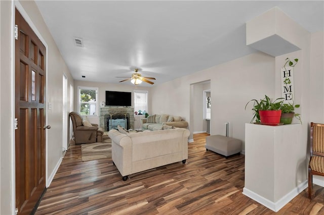 320 S Pleasant St, Springdale, AR 72764 - living area with dark wood-style floors, a fireplace, ceiling fan, and baseboards