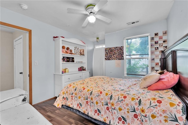 320 S Pleasant St, Springdale, AR 72764 - bedroom with dark wood-style flooring, ceiling fan, and baseboards
