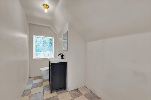 320 S Pleasant St, Springdale, AR 72764 - bathroom with vaulted ceiling, toilet, and vanity
