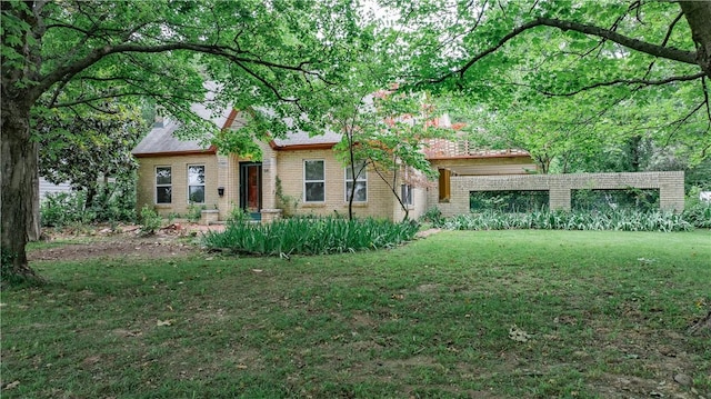 320 S Pleasant St, Springdale, AR 72764 - view of front of home featuring brick siding and a front yard