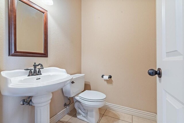 4204 Warbal Trl, Rogers, AR 72758 - half bathroom featuring tile patterned flooring, toilet, and baseboards