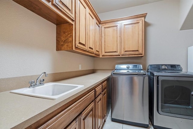 4204 Warbal Trl, Rogers, AR 72758 - washroom featuring washing machine and clothes dryer, cabinet space, and light tile patterned floors