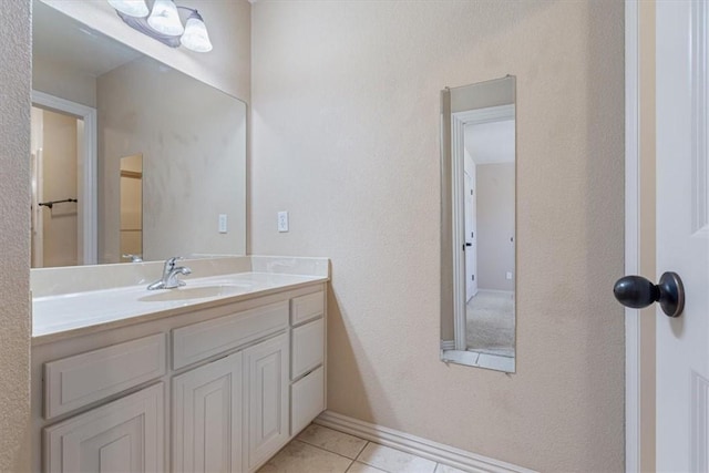 4204 Warbal Trl, Rogers, AR 72758 - bathroom featuring vanity, tile patterned floors, and baseboards