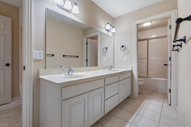 4204 Warbal Trl, Rogers, AR 72758 - bathroom with double vanity, toilet, combined bath / shower with glass door, and tile patterned flooring