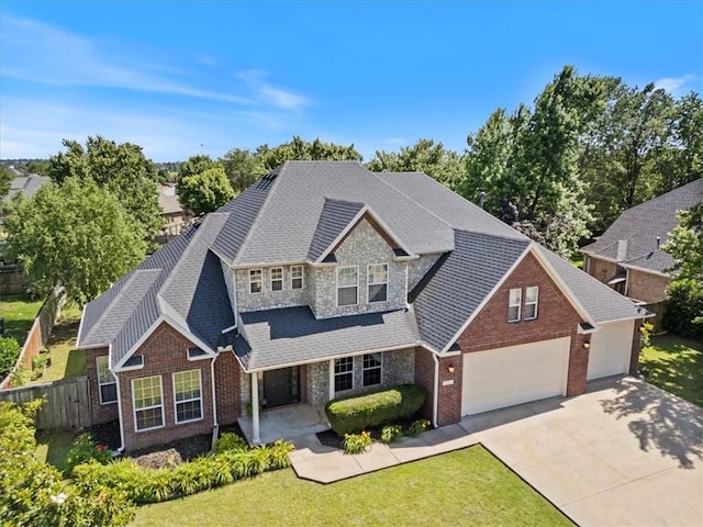 4204 Warbal Trl, Rogers, AR 72758 - traditional-style home featuring brick siding, concrete driveway, a garage, and roof with shingles